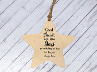 a wooden star ornament with a quote on it