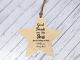 a wooden star ornament with a quote on it