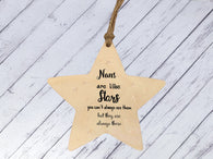 a wooden star ornament hanging from a string