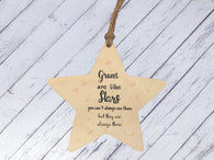 a wooden star ornament hanging from a string