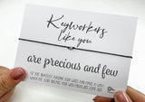 a person holding a card with a message on it