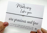 a person holding a card with a message on it