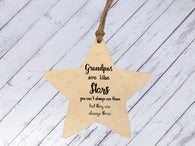 a wooden star ornament hanging from a string