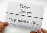 a person holding a card with a message on it