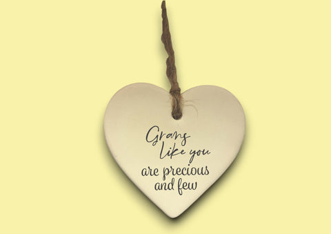 a ceramic heart hanging on a string