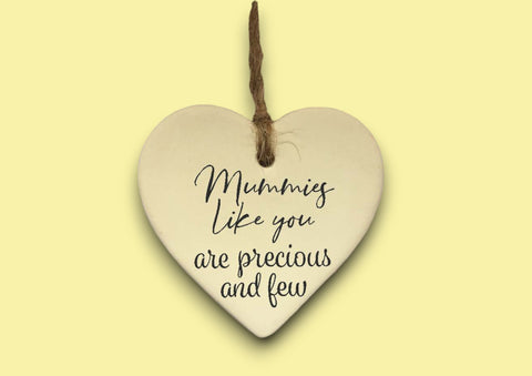 a ceramic heart hanging on a string
