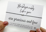 two hands holding a card that says, bridesmaids like you are precious and