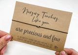 a person holding a card with a message on it