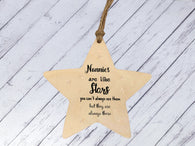 a wooden star ornament with a message on it