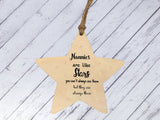 a wooden star ornament with a message on it