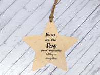 a wooden star ornament with a message on it