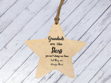 a wooden star ornament hanging on a string